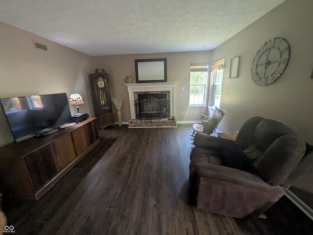 7327 Newbury Ct, Fishers, IN 46038 - living area with a brick fireplace, dark wood finished floors, and a textured ceiling