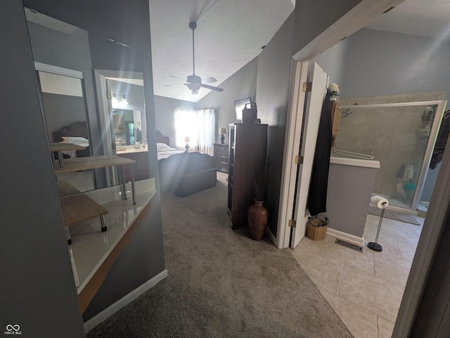 7327 Newbury Ct, Fishers, IN 46038 - full bath with ceiling fan, a shower with door, lofted ceiling, and tile patterned floors