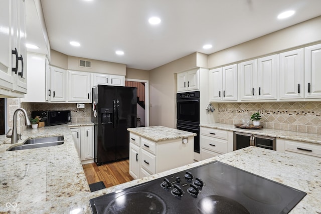 118 White Horse Ln, Fishers, IN 46038 - kitchen featuring black appliances, wine cooler, decorative backsplash, white cabinets, and recessed lighting