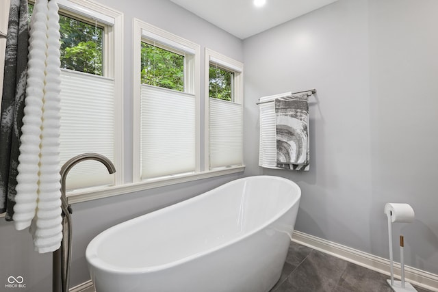 118 White Horse Ln, Fishers, IN 46038 - bathroom with a freestanding bath and baseboards