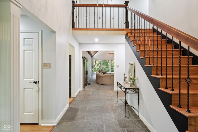 118 White Horse Ln, Fishers, IN 46038 - entryway with stairs, stone finish floors, and a towering ceiling