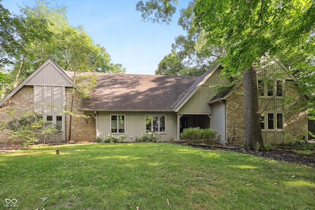 118 White Horse Ln, Fishers, IN 46038 - view of front of home with stone siding, roof with shingles, and a front yard