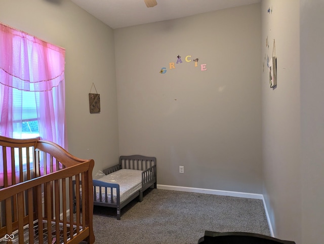 2032 Indiana Ave, Columbus, IN 47201 - bedroom featuring carpet floors, a crib, and a ceiling fan