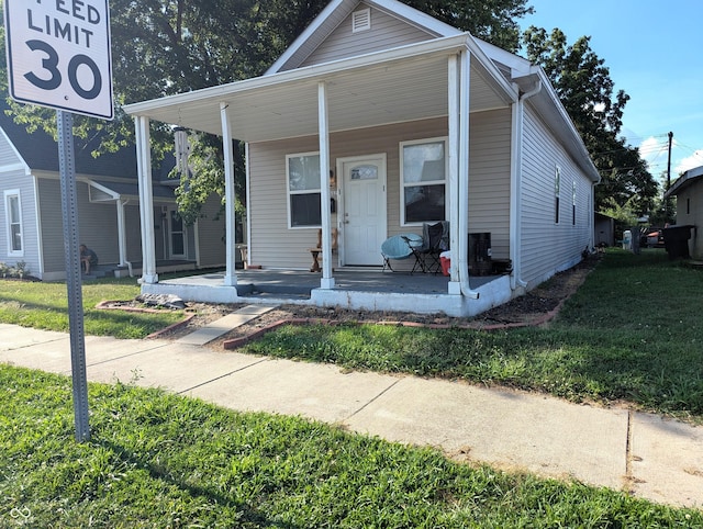 2032 Indiana Ave, Columbus, IN 47201 - view of front of house with a porch and a front yard