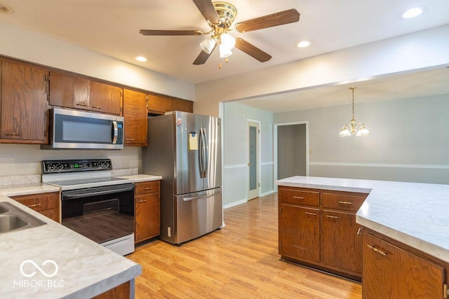 1189 N County Road 475 E, Avon, IN 46123 - kitchen with appliances with stainless steel finishes, light countertops, decorative light fixtures, light wood-type flooring, and recessed lighting