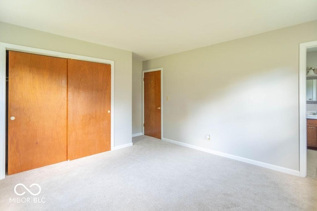 1189 N County Road 475 E, Avon, IN 46123 - unfurnished bedroom featuring light carpet, a closet, and connected bathroom