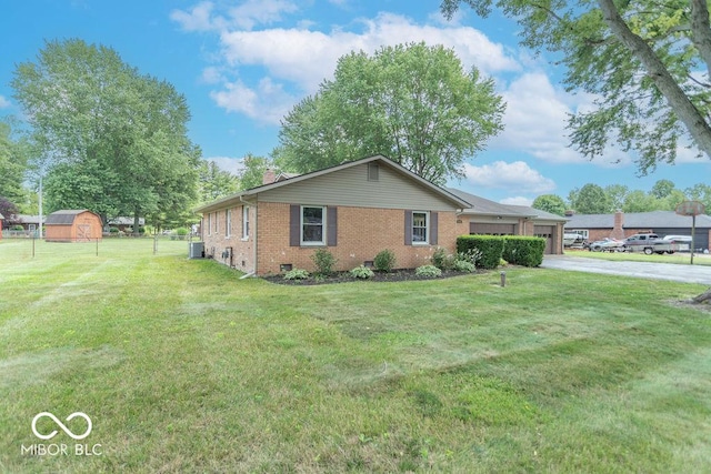 1189 N County Road 475 E, Avon, IN 46123 - view of front of property featuring brick siding, a chimney, a front yard, a garage, and driveway