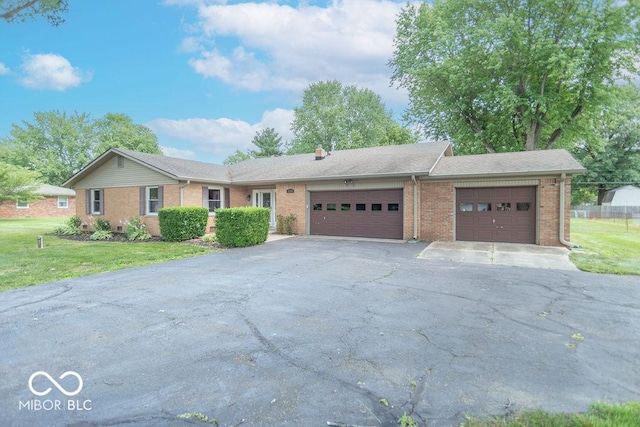 1189 N County Road 475 E, Avon, IN 46123 - ranch-style home featuring a garage, driveway, brick siding, and a front yard