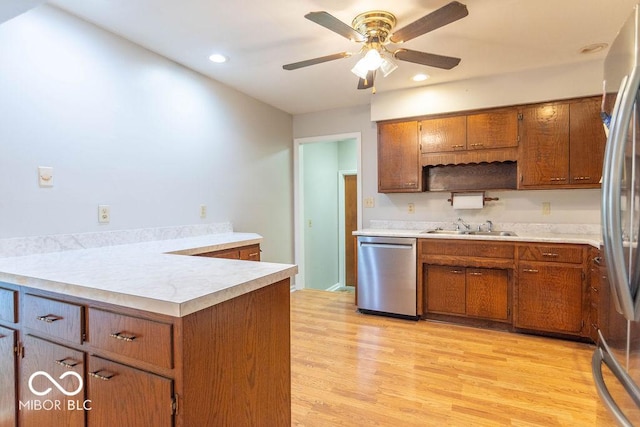 1189 N County Road 475 E, Avon, IN 46123 - kitchen featuring stainless steel appliances, brown cabinetry, light countertops, light wood-type flooring, and recessed lighting