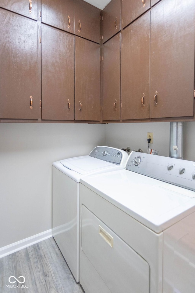 1189 N County Road 475 E, Avon, IN 46123 - washroom with cabinet space, washing machine and clothes dryer, and light wood-style flooring