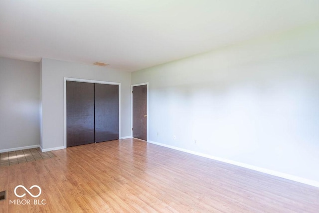 1189 N County Road 475 E, Avon, IN 46123 - unfurnished bedroom featuring wood finished floors and a closet