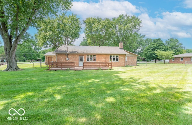 1189 N County Road 475 E, Avon, IN 46123 - back of house featuring a wooden deck, a chimney, and brick siding