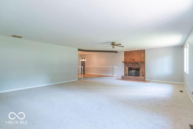 1189 N County Road 475 E, Avon, IN 46123 - unfurnished living room with a ceiling fan, a fireplace, and carpet