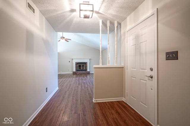 8809 Haddington Dr N, Indianapolis, IN 46256 - hallway featuring a textured ceiling, dark wood-style floors, and lofted ceiling