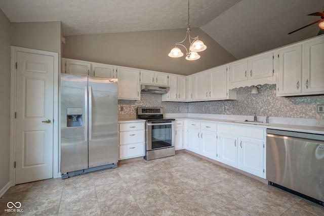 8809 Haddington Dr N, Indianapolis, IN 46256 - kitchen featuring appliances with stainless steel finishes, under cabinet range hood, light countertops, backsplash, and white cabinets