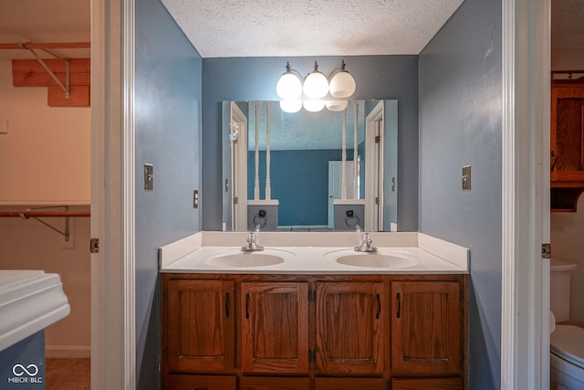 8809 Haddington Dr N, Indianapolis, IN 46256 - bathroom with double vanity and a textured ceiling