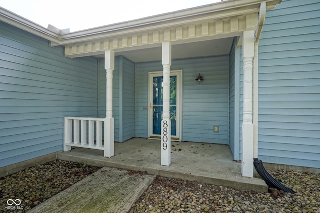 8809 Haddington Dr N, Indianapolis, IN 46256 - doorway to property featuring covered porch