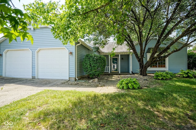 8809 Haddington Dr N, Indianapolis, IN 46256 - view of front of property with concrete driveway, a front lawn, and an attached garage