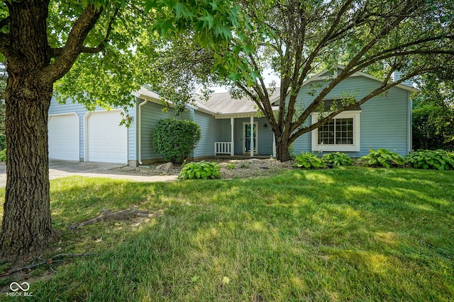 8809 Haddington Dr N, Indianapolis, IN 46256 - view of front facade with an attached garage, a front lawn, and driveway
