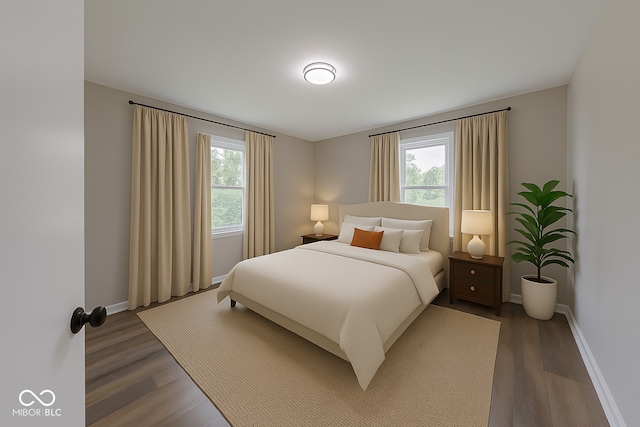 3748 N Olney St, Indianapolis, IN 46218 - bedroom with multiple windows and dark wood-style flooring