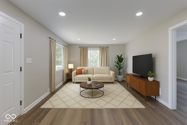 3748 N Olney St, Indianapolis, IN 46218 - living room featuring dark wood-style floors and recessed lighting