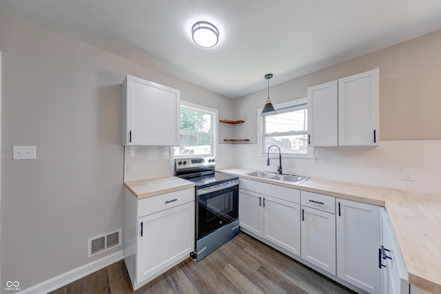 3748 N Olney St, Indianapolis, IN 46218 - kitchen with stainless steel range with electric stovetop, dark wood-style floors, tasteful backsplash, and white cabinetry