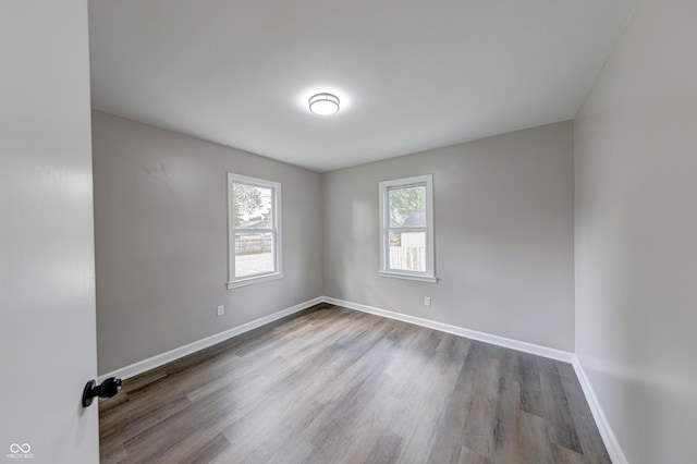 3748 N Olney St, Indianapolis, IN 46218 - unfurnished room with wood finished floors and baseboards