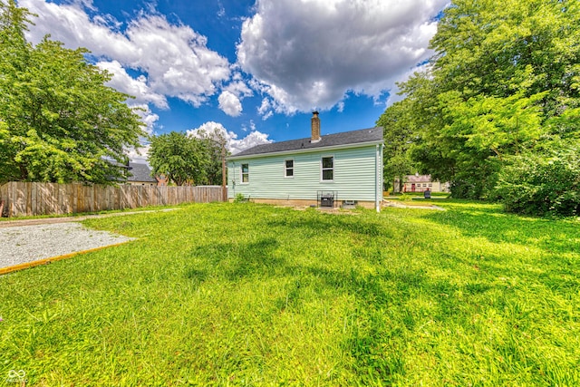 3748 N Olney St, Indianapolis, IN 46218 - rear view of house with a chimney