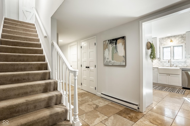 8627 Emerald Ln, Indianapolis, IN 46260 - stairs featuring a baseboard radiator and recessed lighting