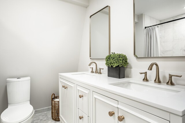 8627 Emerald Ln, Indianapolis, IN 46260 - bathroom with double vanity and a shower with curtain