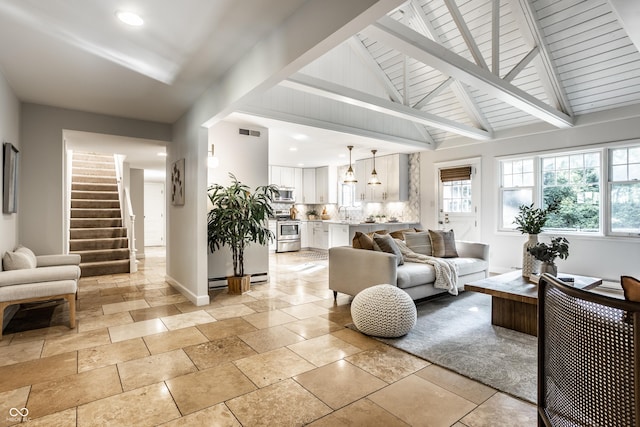 8627 Emerald Ln, Indianapolis, IN 46260 - living area featuring recessed lighting, healthy amount of natural light, stairway, beamed ceiling, and stone tile floors