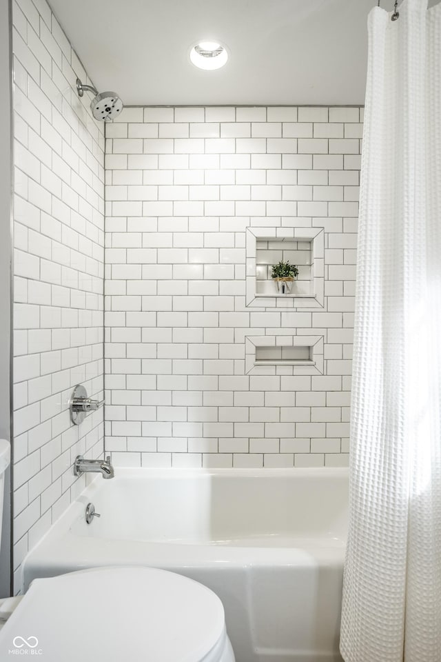8627 Emerald Ln, Indianapolis, IN 46260 - bathroom featuring shower / tub combo with curtain and toilet