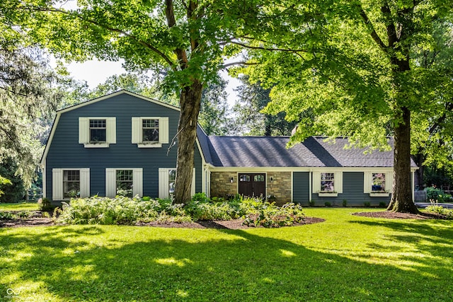 8627 Emerald Ln, Indianapolis, IN 46260 - view of front facade featuring a front lawn and stone siding