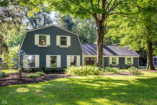8627 Emerald Ln, Indianapolis, IN 46260 - colonial inspired home with a front yard and a gambrel roof