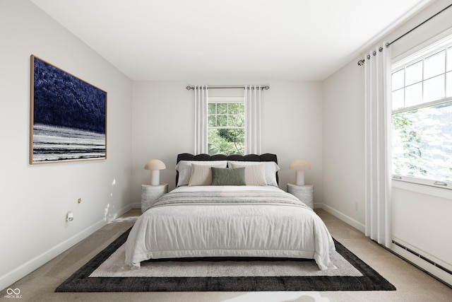 8627 Emerald Ln, Indianapolis, IN 46260 - carpeted bedroom with baseboards and baseboard heating