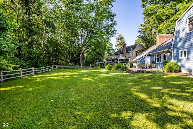 8627 Emerald Ln, Indianapolis, IN 46260 - fenced backyard featuring a patio area