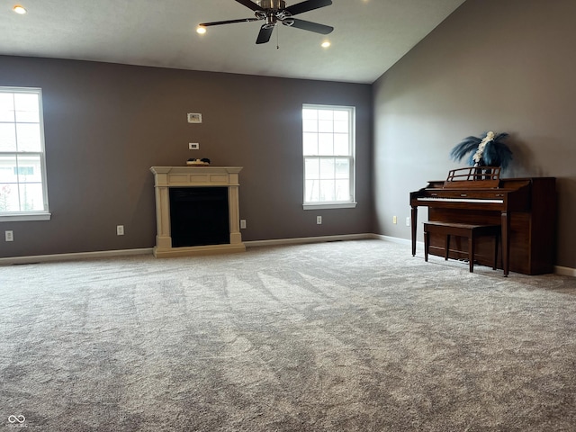 1646 N Nieman Dr, Greensburg, IN 47240 - carpeted living room featuring vaulted ceiling, ceiling fan, a fireplace, and recessed lighting