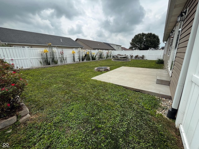 1646 N Nieman Dr, Greensburg, IN 47240 - fenced backyard featuring a patio area and a fire pit