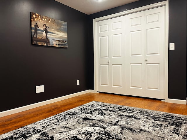 1646 N Nieman Dr, Greensburg, IN 47240 - unfurnished bedroom featuring wood finished floors and a closet