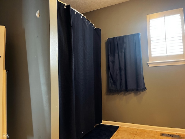 1646 N Nieman Dr, Greensburg, IN 47240 - full bath with tile patterned flooring, a textured ceiling, and a shower with shower curtain