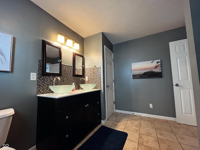 1646 N Nieman Dr, Greensburg, IN 47240 - full bathroom with double vanity, tile patterned floors, and tasteful backsplash