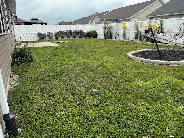 1646 N Nieman Dr, Greensburg, IN 47240 - fenced backyard with a patio area