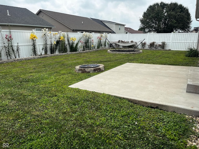 1646 N Nieman Dr, Greensburg, IN 47240 - fenced backyard with a fire pit and a patio