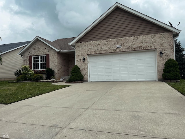 1646 N Nieman Dr, Greensburg, IN 47240 - single story home featuring brick siding, driveway, an attached garage, and a front lawn