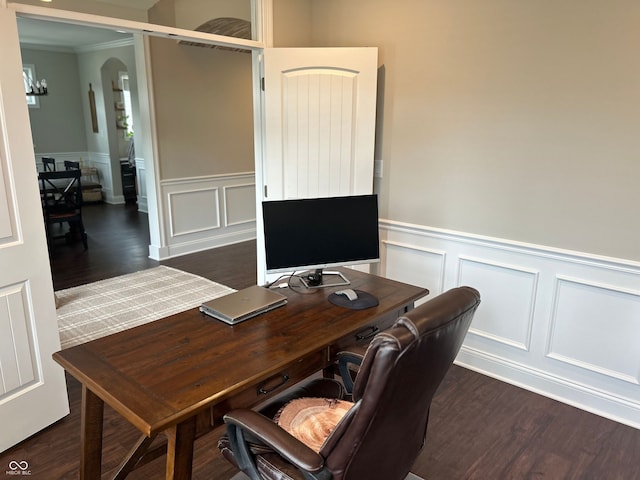 12059 Chapelwood Dr, Fishers, IN 46037 - home office featuring a decorative wall, wainscoting, dark wood-type flooring, ornamental molding, and arched walkways