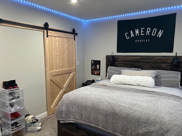 12059 Chapelwood Dr, Fishers, IN 46037 - carpeted bedroom featuring a barn door and baseboards