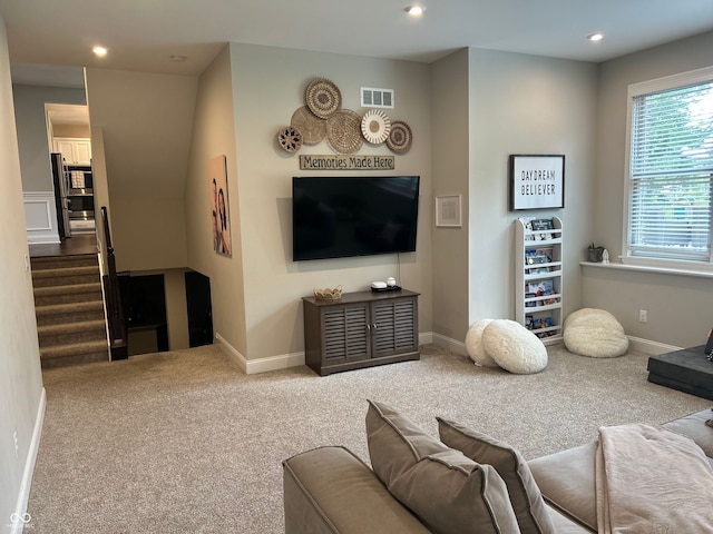 12059 Chapelwood Dr, Fishers, IN 46037 - carpeted living area with recessed lighting and stairway