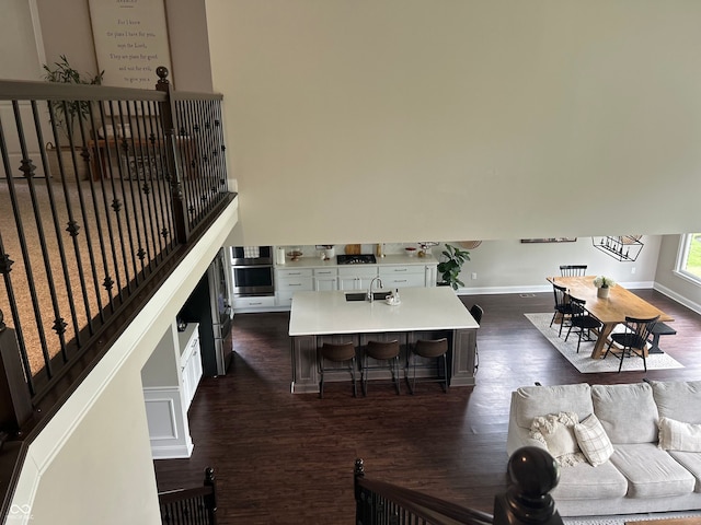 12059 Chapelwood Dr, Fishers, IN 46037 - living area with dark wood finished floors and baseboards