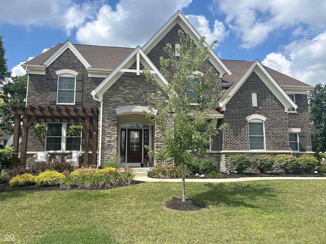 12059 Chapelwood Dr, Fishers, IN 46037 - view of front of property with a pergola, a front yard, stone siding, brick siding, and a shingled roof