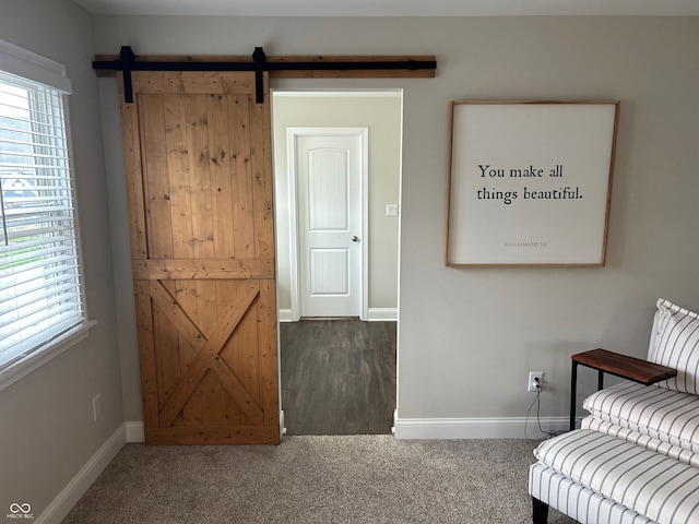12059 Chapelwood Dr, Fishers, IN 46037 - sitting room featuring a barn door and carpet floors